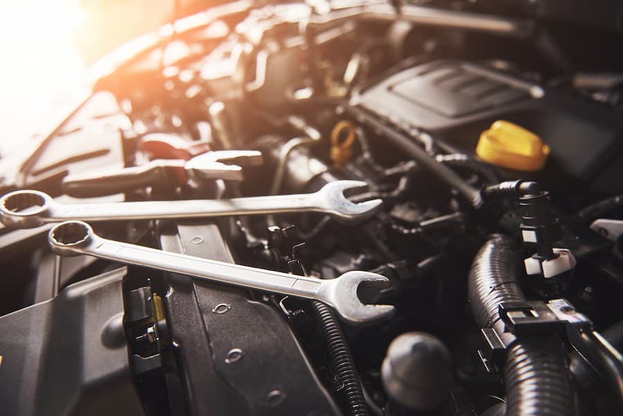 mechanic-hand-checking-fixing-broken-car-car-service-garage (1)